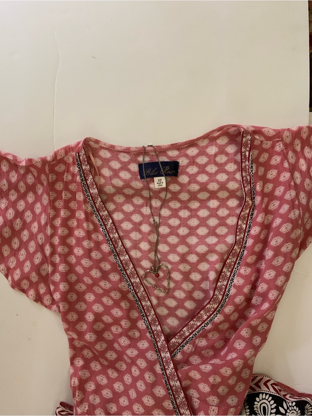 Coral and cream Printed Wrap Dress with Black Patterned Sash and bottom ruffle - Picture 2 of 5